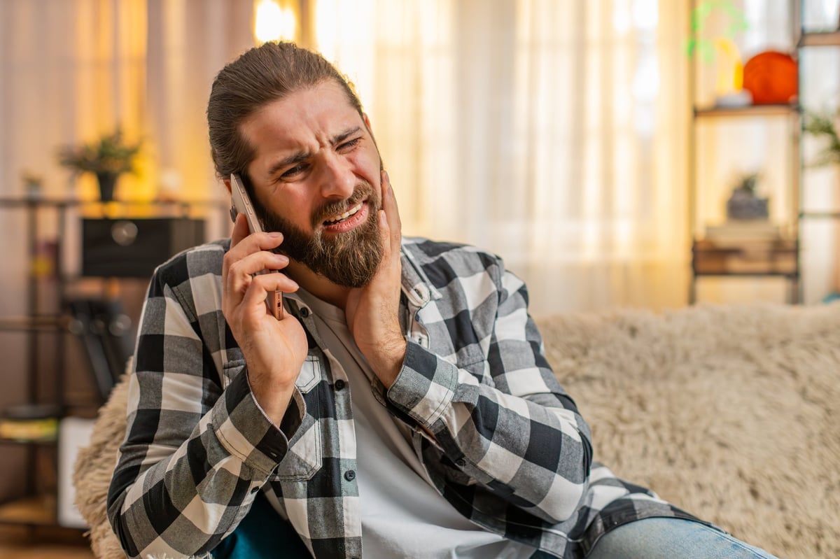 Emergency dentist on the Gold Coast assessing a patient experiencing sudden dental pain